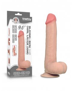 realistische-dildo-met-balzak-sliding-skin-22-86-cm-huidskleur naast doos